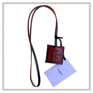 • New • Balmain Paris Hand Strap Keychain Bag Strap W Tags Unisex in Heel/Tacco